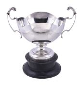 A silver twin handled trophy cup by Walker & Hall, Sheffield 1927, with leaf-capped handles, an