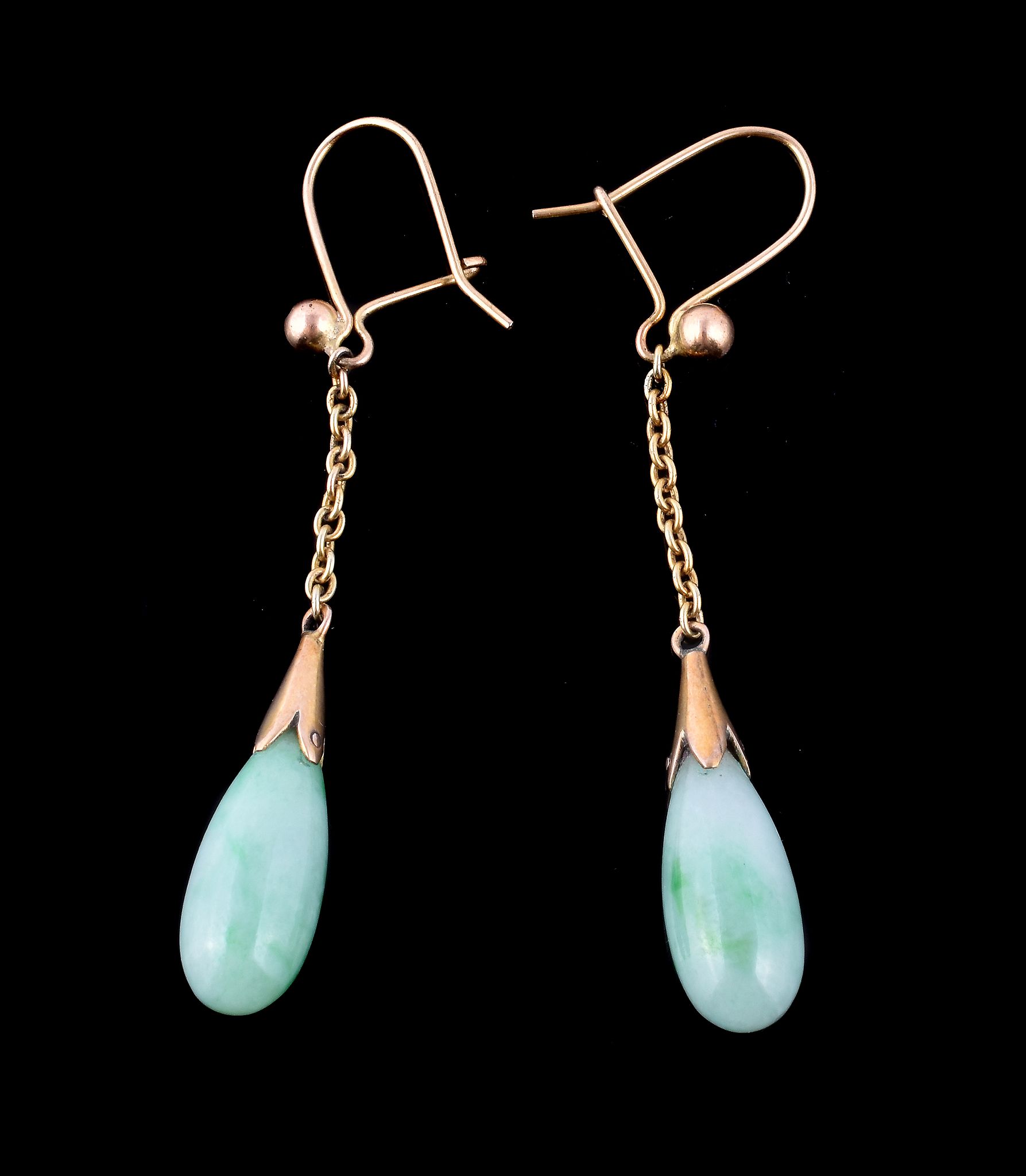 A pair of 1930s jadeite drop earpendants, the polished jadeite drops with gold caps, suspended