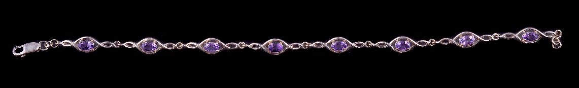 An amethyst bracelet, set with oval cut amethysts in twisting settings, 18.5cm long, together with