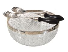 Ω A Victorian cut glass salad bowl with a silver rim and a pair of servers by John Grinsell & Sons,