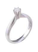 An 18 carat gold diamond single stone ring, the brilliant cut diamond , estimated to weigh 0.15