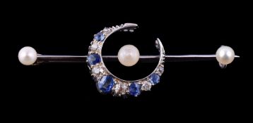 A late Victorian sapphire, diamond and pearl crescent brooch, circa 1900, the crescent set with
