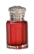 A Victorian silver mounted cranberry glass scent bottle by Miller Brothers, Birmingham 1895, with a
