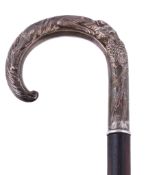 A silver mounted walking stick by W. I. Broadway & Co., Birmingham 1981, the handle modelled with a