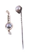 A cultured pearl pendant, the grey cultured pearl on a pierced black enamelled setting, suspending
