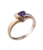 An amethyst and diamond ring, the heart shaped amethyst, claw set with brilliant cut diamond