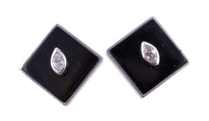 A pair of onyx and diamond ear clips, the square shaped onyx panels each set with a marquise cut
