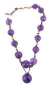 A Victorian amethyst bead necklace, circa 1870, the graduated polished amethyst beads with gold