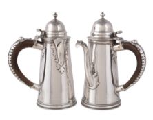 A matched pair of silver tapering cafe au lait pots by Garrard & Co. Ltd., London 1907 and 1916,