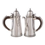 A matched pair of silver tapering cafe au lait pots by Garrard & Co. Ltd., London 1907 and 1916,