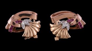 A pair of 1940s ruby and diamond earrings, designed as stylised lotus flowers, set with old cut