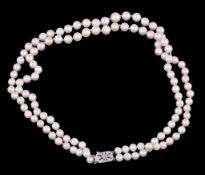 A double strand cultured pearl necklace, the slightly graduated pearls, measuring 6mm to 8mm, on a