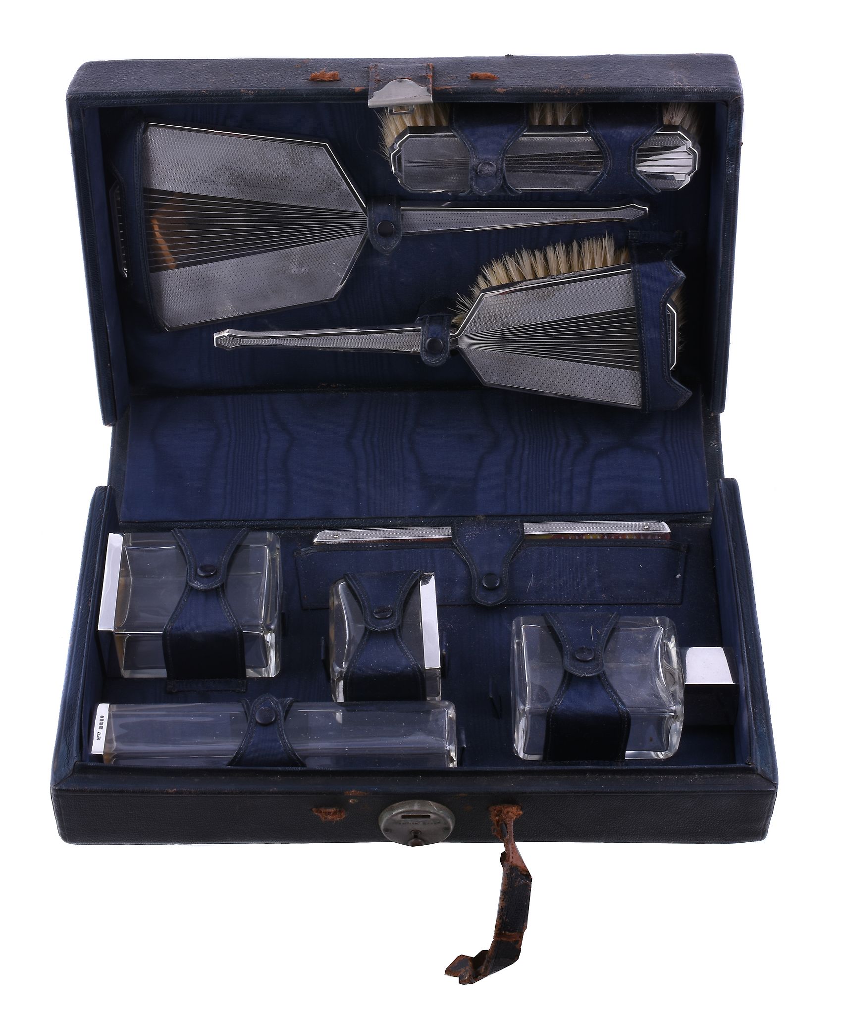 Ω A cased silver mounted eight piece travelling dressing table set by Collett & Anderson, London