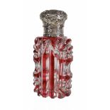 A Victorian silver mounted ruby flash cut glass scent bottle, unmarked, mid 19th century, with a