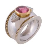 An 18 carat gold pink spinel and diamond ring by Theo Fennell, the oval cut pink spinel collet set