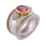 An 18 carat gold pink spinel and diamond ring by Theo Fennell, the oval cut pink spinel collet set