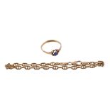 A gold coloured bracelet, composed of fancy links, to a lobster claw clasp, stamped 750 with