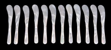 Ω A set of twelve mother of pearl caviar knives, circa 1930, in a case from The Goldsmiths &