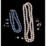 A cultured pearl necklace, the uniform cultured pearls measuring 7mm, 68cm long; together with a