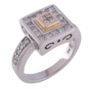 A diamond dress ring, the squared panel set with princess cut diamonds, to brilliant cut diamond
