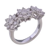 A diamond cluster ring, the three flower head clusters set with brilliant cut diamonds,