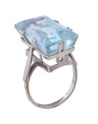 An aquamarine ring, the rectangular cut aquamarine in a claw setting, stamped 18ct, finger size N