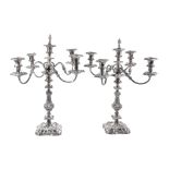 A pair of old Sheffield plate five light four branch candelabra, unmarked, circa 1820, with a