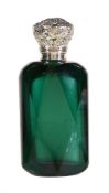 A Victorian silver mounted dark green cut glass scent bottle, unmarked, mid 19th century, with a