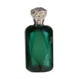 A Victorian silver mounted dark green cut glass scent bottle, unmarked, mid 19th century, with a