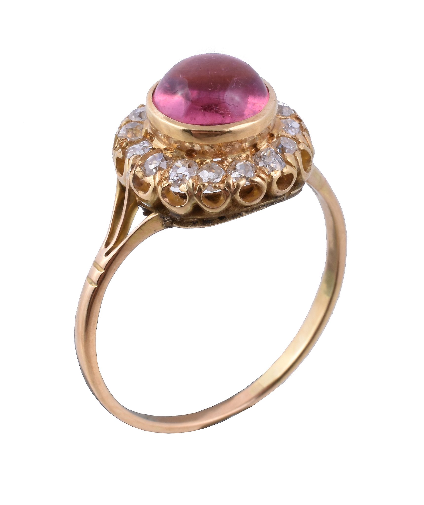 A pink tourmaline and diamond ring, the circular cabochon pink tourmaline collet set within a