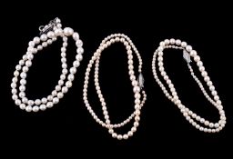 A cultured pearl necklace, composed of graduated 4mm to 9mm cultured pearls, the clasp set with
