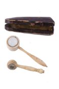 Ω Two unusual early/mid 19th century miniature magnifying glasses, in ivory and in bone, with