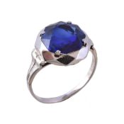 A 1940s French synthetic sapphire ring, the circular cut synthetic sapphire in a four claw setting,
