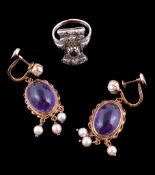 A pair of amethyst and cultured pearl earrings, the oval cabochon amethyst within a ropetwist