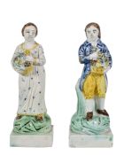 A pair of Staffordshire pearlware figures of a gardener and companion , first quarter 19th century,