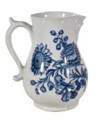 A Worcester blue and white baluster mask jug printed with the 'Chrysanthemum and Rose Group'