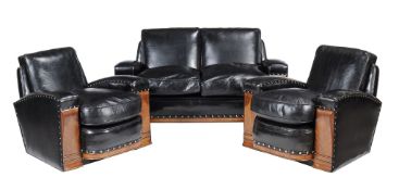 An Art Deco walnut and black leather three piece lounge suite , reupholstered, 1930s, comprising: a