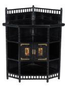 An Aesthetic Movement ebonised standing corner cupboard , circa 1890, with spindle galleries, three