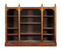 A Reformed Gothic ash and parcel ebonised open bookcase, circa 1880, 155cm high, 183cm wide, 38cm