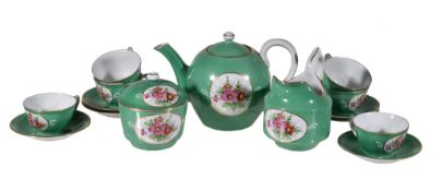 A Moscow porcelain (Gardner) green-ground part tea service, late 19th century, painted with panels