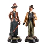 A pair of Bohemian painted terracotta figures by Bernard Bloch & Co., of a turn-of-the-century lady