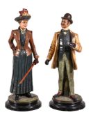 A pair of Bohemian painted terracotta figures by Bernard Bloch & Co., of a turn-of-the-century lady