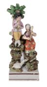 A pearlware figural group of a musician and companion, first quarter 19th century, 21cm high