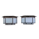 A pair of Art Deco hexagonal ceiling lights, 1930s, patinated bronze and frosted glass, six