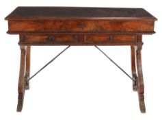 An Italian walnut desk, early 18th century, the hinged front section of the top and hinged frieze