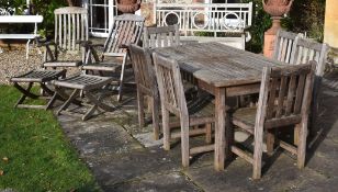 A teak garden dining set comprising table and six chairs, modern, the rectangular slatted table on