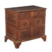 An oak chest of drawers , circa 1700, of small proportion, with three long drawers each with