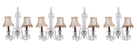 A set of four cut glass twin light wall appliques in George III style, 20th century, the urn