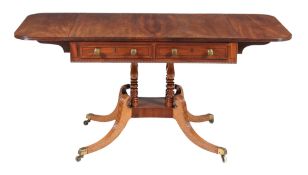 A Regency mahogany sofa table, circa 1815, in the manner of William Trotter, with a pair of false