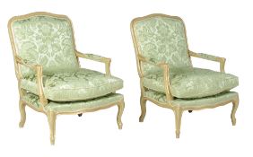 A p air of green painted and parcel gilt armchairs in Louis XV style , 20th century, upholstered in